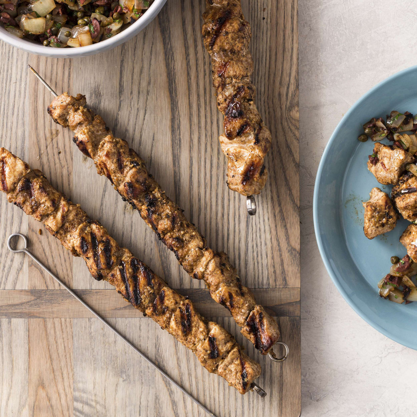 Food Column ATK Grilled Spiced Pork Skewers with Onion and Caper Relish